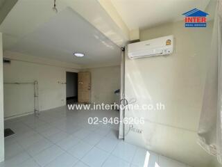 Spacious and bright living room with air conditioning unit
