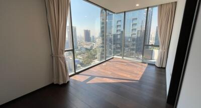 Bright and spacious bedroom with large windows and city view