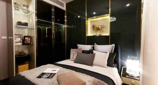 Modern bedroom with artistic decor and ambient lighting