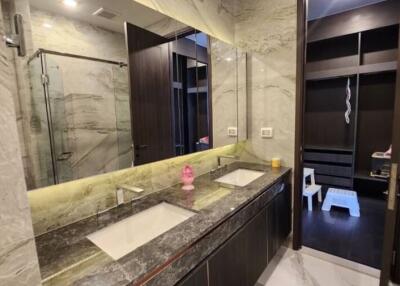 Luxurious modern bathroom with marble finishes and double vanity