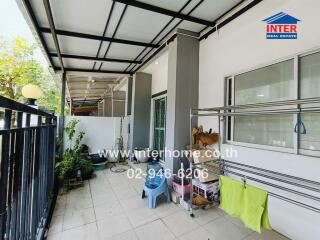 Spacious covered patio with modern amenities in a residential property