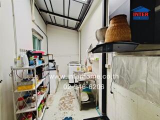 Cluttered utility room with storage and appliances