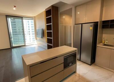 Modern kitchen with integrated appliances and adjacent living area