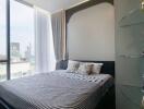 Modern bedroom with large window and city view