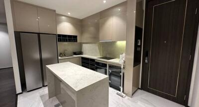 Modern kitchen with marble island and high-end appliances