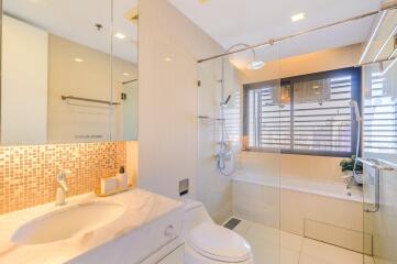 Spacious bathroom with modern fittings and natural light
