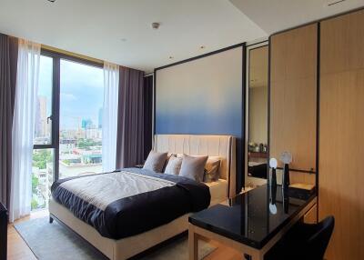 Spacious bedroom with city view and modern design