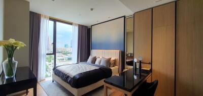 Spacious bedroom with city view and modern design