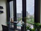 Modern room with glass desk near large windows overlooking the city