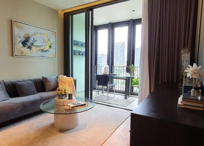 Modern living room with balcony access and contemporary artwork