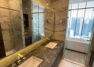 Modern bathroom with marble countertops and dual sinks