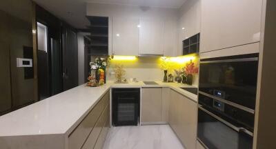 Modern kitchen with integrated appliances and under-cabinet lighting