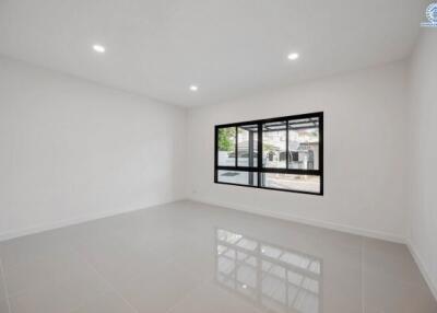 Spacious and brightly lit living room with large window