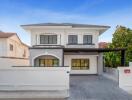 Modern two-story house with spacious driveway and garage