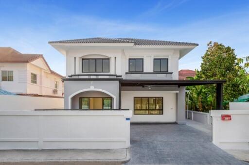 Modern two-story house with spacious driveway and garage