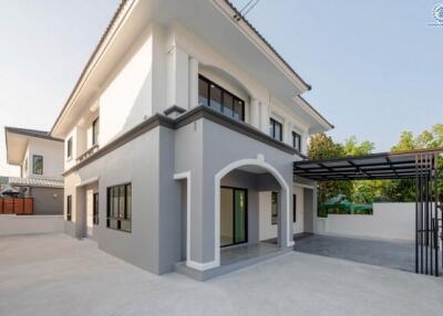 Modern two-story house with external carport