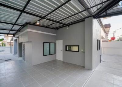 Spacious enclosed garage with tiled flooring and modern design