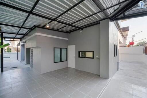 Spacious enclosed garage with tiled flooring and modern design