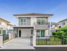 Modern two-story house with spacious driveway and balcony