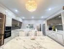 Elegant modern kitchen with marble countertops and sophisticated lighting