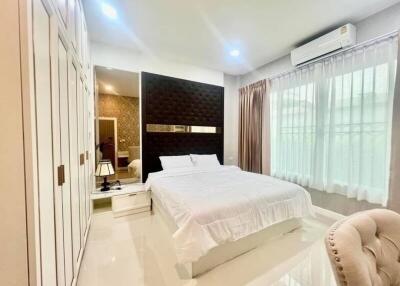 Spacious and elegantly designed bedroom with modern furnishings