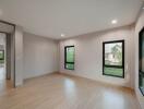 Spacious and well-lit living room with large windows