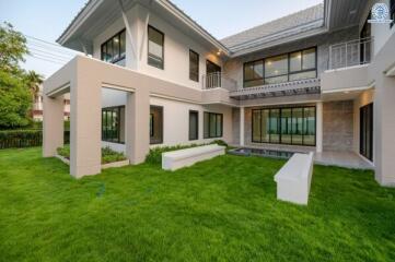Modern two-story house with spacious green lawn