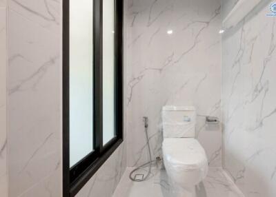 Modern bathroom with marble walls and sleek design