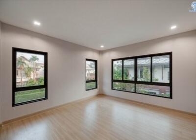Spacious and bright empty living room with large windows