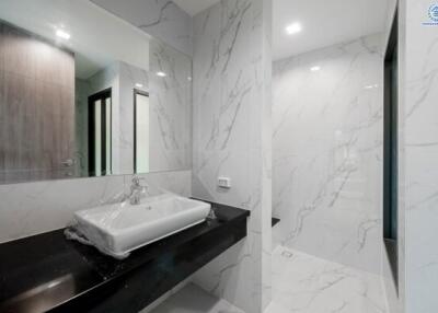 Modern bathroom with marble tiles and sleek design