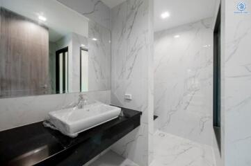 Modern bathroom with marble tiles and sleek design
