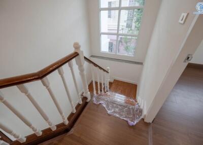 Well-maintained wooden staircase with natural light