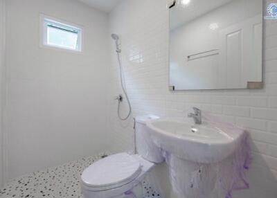 Modern minimalist bathroom with white furnishings