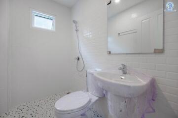 Modern minimalist bathroom with white furnishings