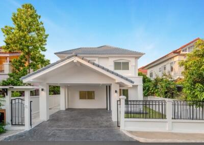 Modern two-story house with landscaped front yard and spacious driveway