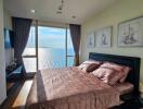 Bright bedroom with ocean view and elegant decor
