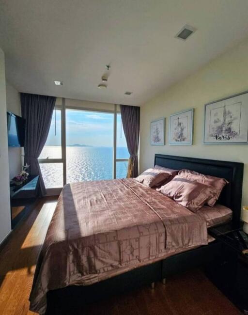 Bright bedroom with ocean view and elegant decor
