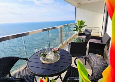 Ocean view balcony with seating arrangement