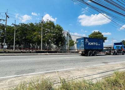 Busy street view with overhead cables and a passing truck