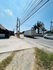 Street view outside the property showing road and nearby businesses