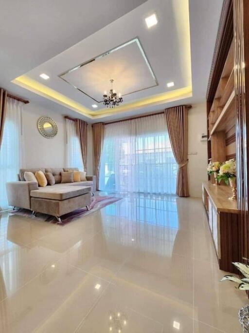 Spacious and elegantly decorated living room with natural lighting