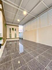 Spacious and modern balcony with tiled flooring and ample lighting