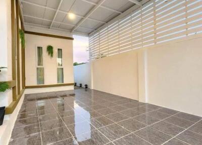 Spacious and modern balcony with tiled flooring and ample lighting
