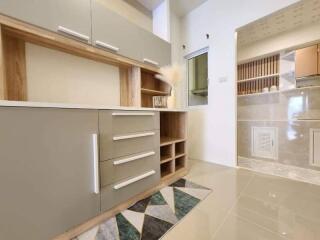 Modern kitchen with built-in cabinets and stylish tiling