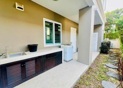 Spacious home patio with outdoor sink and ample shelving