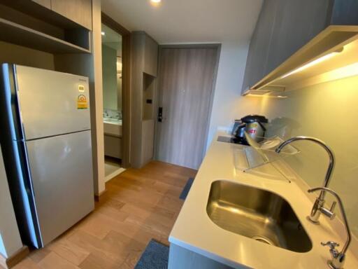 Modern kitchen with stainless steel appliances and wooden floor