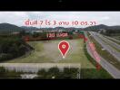 aerial view of a vacant land near a highway with distance markers to nearby destinations