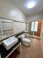 Spacious bathroom with modern fixtures and natural lighting