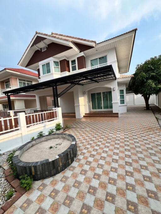 Spacious two-story house with tiled driveway and front yard