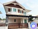 Modern two-story house with carport and balcony